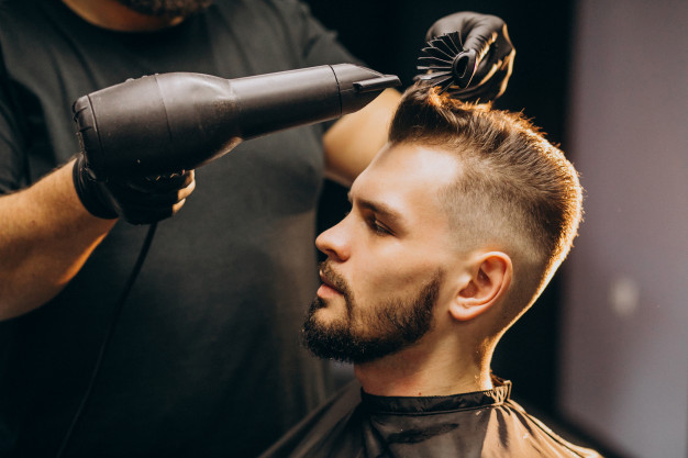 handsome-man-barber-shop-styling-hair_1303-20978