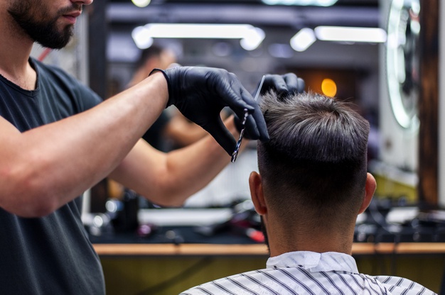 medium-shot-man-getting-haircut_23-2148256909